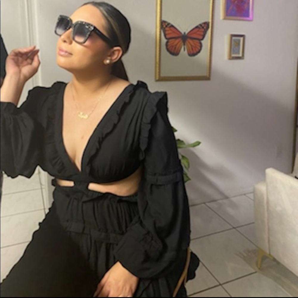 Black dress that shows midriff and open back. It’s only been worn once as shown